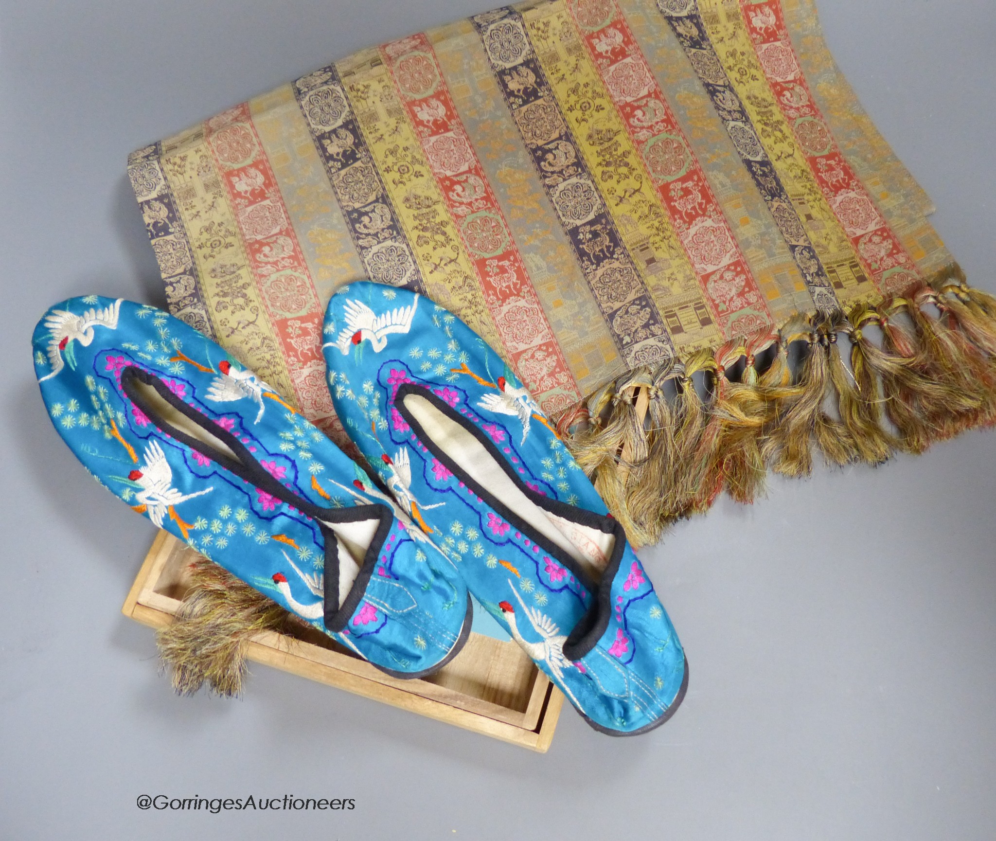 A pair of Chinese silkwork slippers and a Japanese table runner